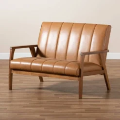 Nikko Mid-Century Faux Leather Upholstered Wood Loveseat Walnut/Brown - Baxton Studio 15 Nikko Mid-Century Faux Leather Upholstered Wood Loveseat Walnut/Brown - Baxton Studio -Furniture Shop GUEST 523a5df4 2552 4576 a2e6 22ac3329118d
